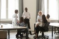 Black team leader boss talking with corporate staff at break Royalty Free Stock Photo