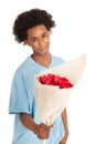 Black teen boy is giving flowers