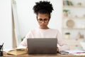 Black Teen Girl At Laptop Doing Homework Online At Home