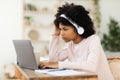 Black Teenager Girl At Laptop Studying Online Sitting At Home Royalty Free Stock Photo