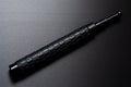 Black telescopic expandable baton / truncheon isolated