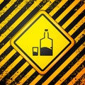 Black Tequila bottle and shot glass icon isolated on yellow background. Mexican alcohol drink. Warning sign. Vector Royalty Free Stock Photo