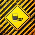 Black Tequila glass with lemon icon isolated on yellow background. Mexican alcohol drink. Warning sign. Vector