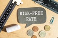 a black text marker and the inscription risk-free rate on it