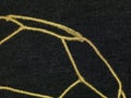 Black textile and gold liens background Royalty Free Stock Photo