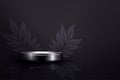 Black textured composition with a gradient, round podium with leaves