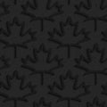 Black textured plastic maple leaves countered