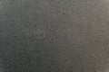Black textured surface of plastic panel close-up Royalty Free Stock Photo