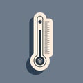 Black Thermometer with scale measuring heat and cold, with sun and snowflake icon isolated on grey background. Long Royalty Free Stock Photo