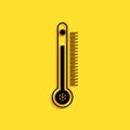 Black Thermometer with scale measuring heat and cold, with sun and snowflake icon isolated on yellow background. Long Royalty Free Stock Photo