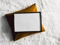 Black thin wooden frame with blank copyspace as poster photo print mockup, golden cushion pillow and fluffy white Royalty Free Stock Photo