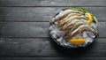 Black tiger prawns with lemon on ice. Seafood. Royalty Free Stock Photo