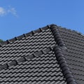 Black tiles roof on a new house Royalty Free Stock Photo