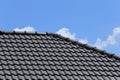 Black tiles roof on a new house Royalty Free Stock Photo