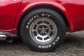 Tire of American red sport muscle car Chevrolet Corvette C3 parked