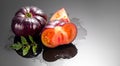 Black tomato, fresh ripe natural bio tomatoes close-up. Tasty organic Black Beauty tomato with leaves