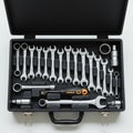 A black tool case contains a set of silver wrenches and sockets Royalty Free Stock Photo