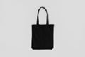 Black tote bag mockup on a grey background Royalty Free Stock Photo