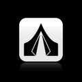 Black Tourist tent icon isolated on black background. Camping symbol. Silver square button. Vector Illustration