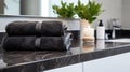 Black towels on marble desk in the foreground and blurred modern bathroom Royalty Free Stock Photo