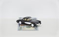 Black toy retro car and us dollars on white background