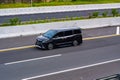 Black Toyota voxy driving fast on trans jawa highway