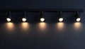 Black track lighting with five spotlights. Royalty Free Stock Photo