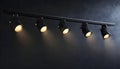 Black track lighting with five spotlights. Royalty Free Stock Photo