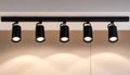 Black track lighting with five spotlights. Royalty Free Stock Photo