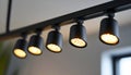 Black track lighting with five spotlights. Royalty Free Stock Photo