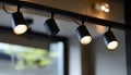 Black track lighting with five spotlights. Royalty Free Stock Photo