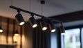 Black track lighting with five spotlights. Royalty Free Stock Photo