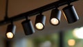Black track lighting with five spotlights. Royalty Free Stock Photo