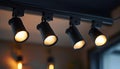Black track lighting with five spotlights. Royalty Free Stock Photo