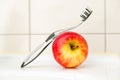 Black and transparent toothbrush with an apple.