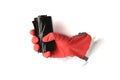 Black trash bag in hand in protective glove on white background