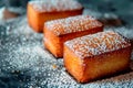 Black treacle financiers cake, elegant French pastries with a veil of powdered sugar the dark cakes
