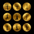 Black trees silhouette icons set with shiny golden elements Royalty Free Stock Photo