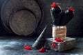 Black trendy ice cream in black waffle icecream cones with red currant berries. Royalty Free Stock Photo