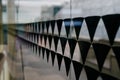 Black triangles on the glass wall. Decorative glass decoration Royalty Free Stock Photo