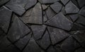 Black triangular shapes arranged closely together create an abstract pattern featuring texture and depth Royalty Free Stock Photo