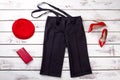 Black trousers with suspenders and red accessories. Royalty Free Stock Photo