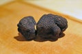 black truffles on a chopping board Royalty Free Stock Photo