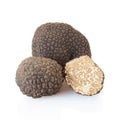 Black truffles and half on white Royalty Free Stock Photo