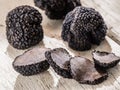 Black truffles on the old wooden table. Royalty Free Stock Photo