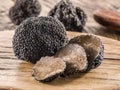 Black truffles on the old wooden table Royalty Free Stock Photo