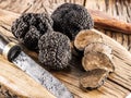 Black truffles on a old wooden table. Royalty Free Stock Photo