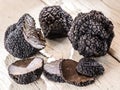 Black truffles on a old wooden table. Royalty Free Stock Photo