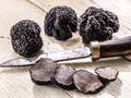 Black truffles on a old wooden table. Royalty Free Stock Photo