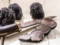 Black truffles on the old wooden table Royalty Free Stock Photo